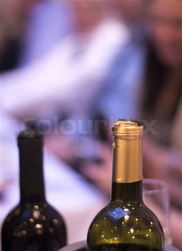 White and red wine bottles in wedding reception party dinner in restaurant photo, stock photo