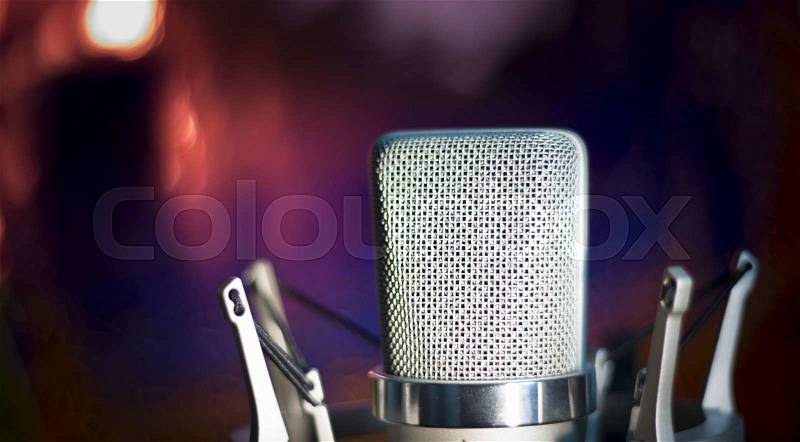Audio recording vocal studio voice microphone with anti shock mount and built in anti pop filter for singing and voiceover actors doing voiceovers, stock photo