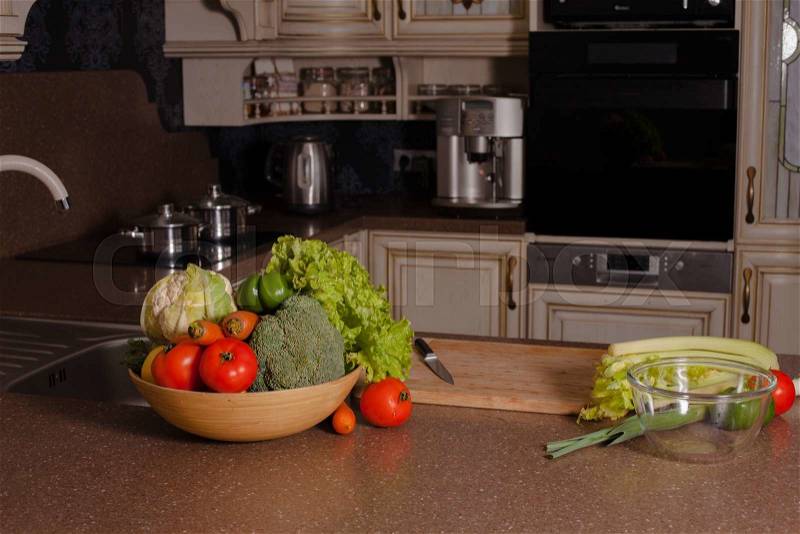 Vegetables near the casseroles in the kitchen, cooking concept, stock photo