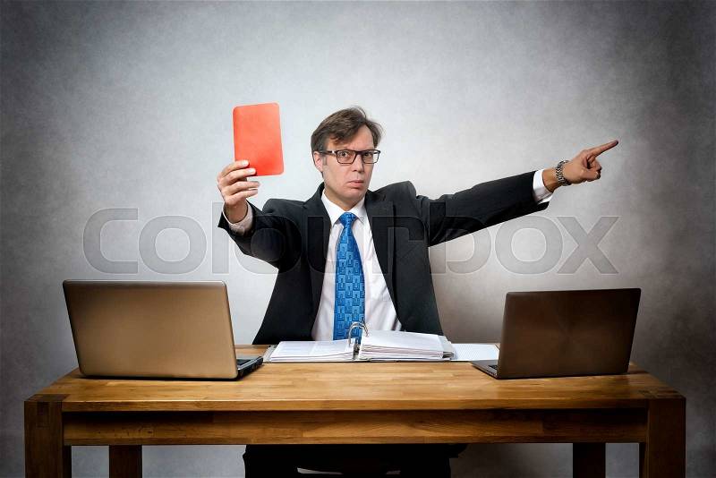 Image of angry and screaming business man with red card in hand in office, stock photo