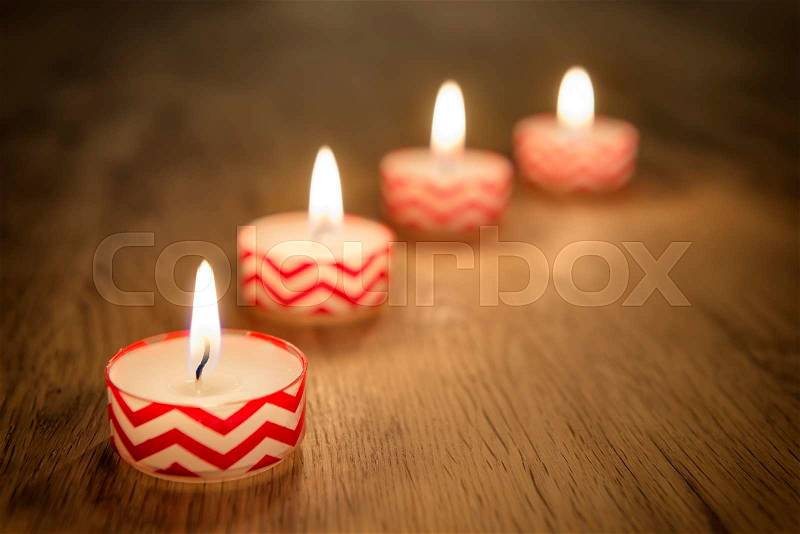 Romantic image of candles on a wooden table, stock photo