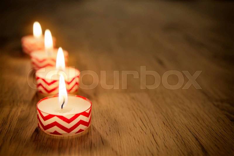 Romantic image of candles on a wooden table, stock photo