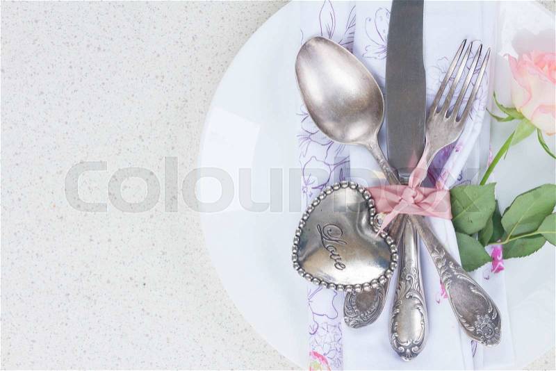 Valentines day dinner with vintage silver cutlery, stock photo