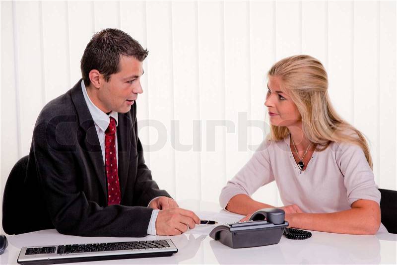Husband and wife in a consultation. Business talk, stock photo