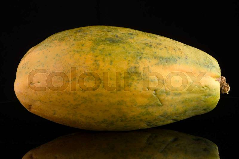 Papaya isolated on a black background, stock photo
