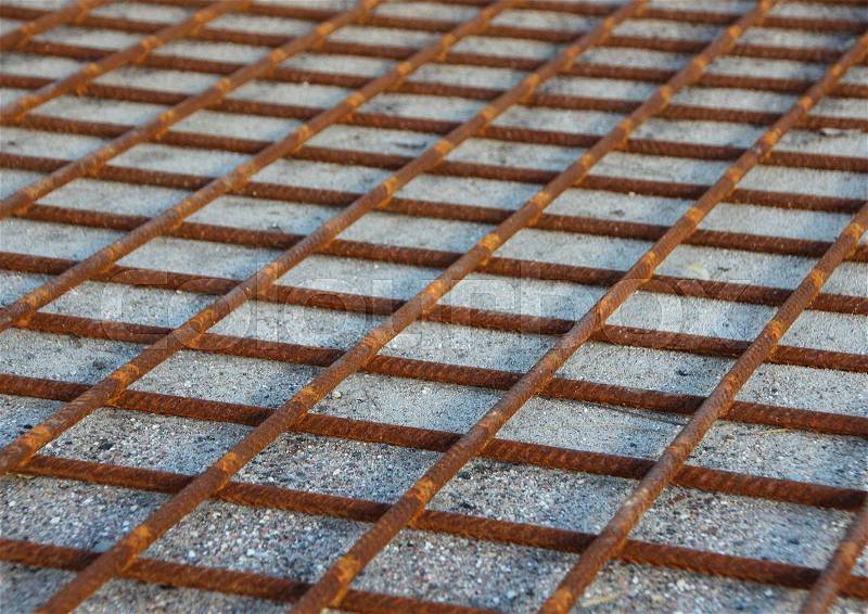 Rusty Metal Foundation Construction Grid on Sand Background, stock photo