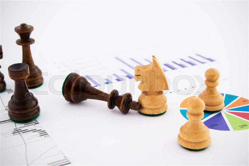 Chess pieces on business background. Company strategic behavior, stock photo