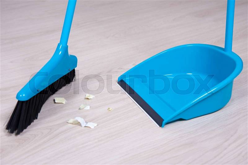 Close up of blue broom and dustpan, stock photo