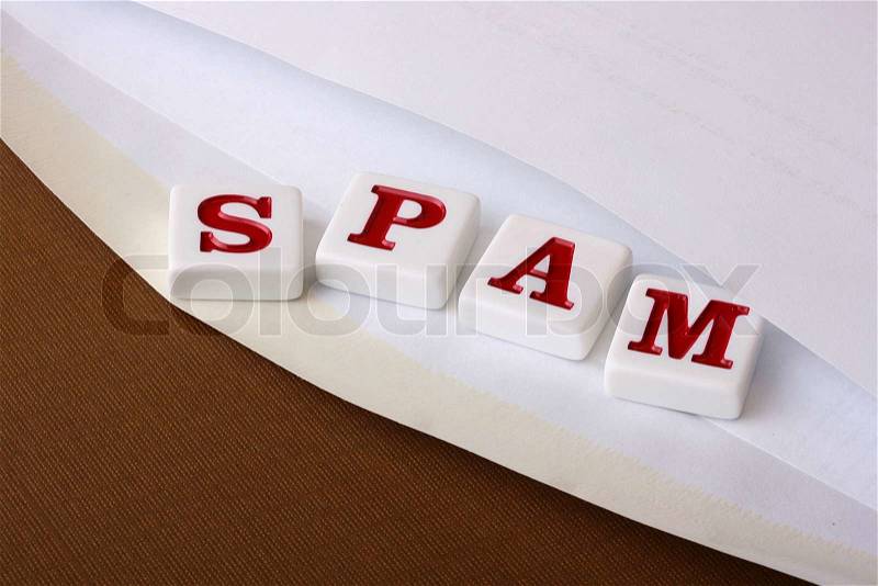 Open envelope for letters from which letters making word SPAM drop out, stock photo