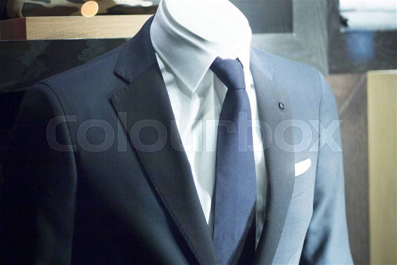 Male man shop dummy fashion mannequin in store boutique shop window at night photo, stock photo