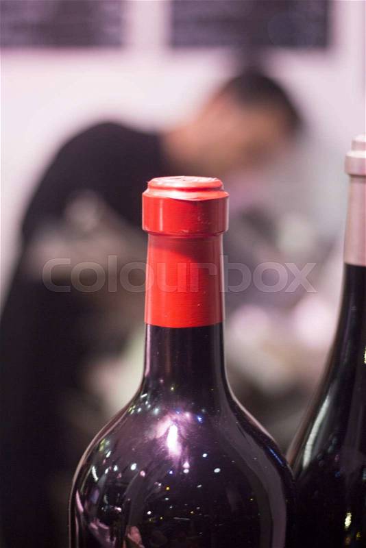 White and red wine bottles in party dinner in restaurant photo, stock photo