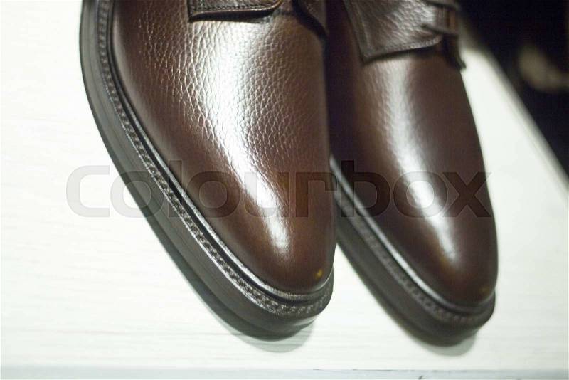 Men\'s leather luxury hand made formal shoes in store window photograph, stock photo
