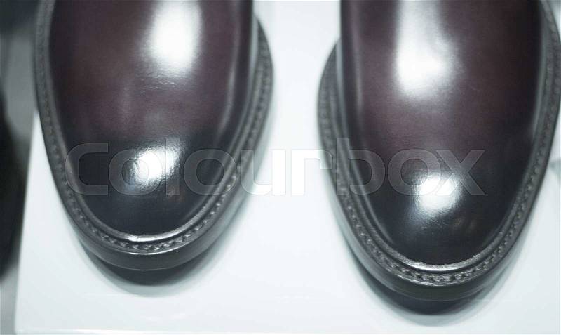 Men\'s leather luxury hand made formal shoes in store window close-up photo, stock photo