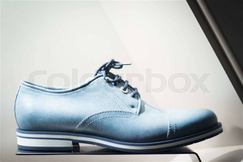 Men\'s blue leather luxury hand made formal shoes in store window photo, stock photo