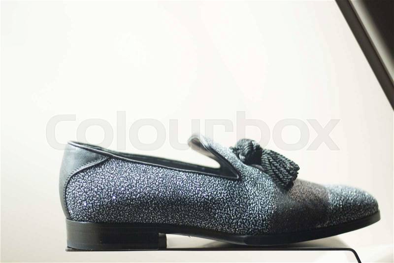 Men's leather luxury hand made formal shoes in store window close-up photo, stock photo