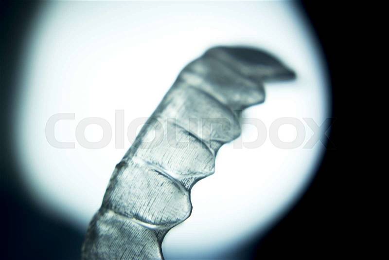 Invisible dental aligners modern tooth brackets transparent teeth braces to straighten teeth in cosmetic dentistry and orthodontics, stock photo