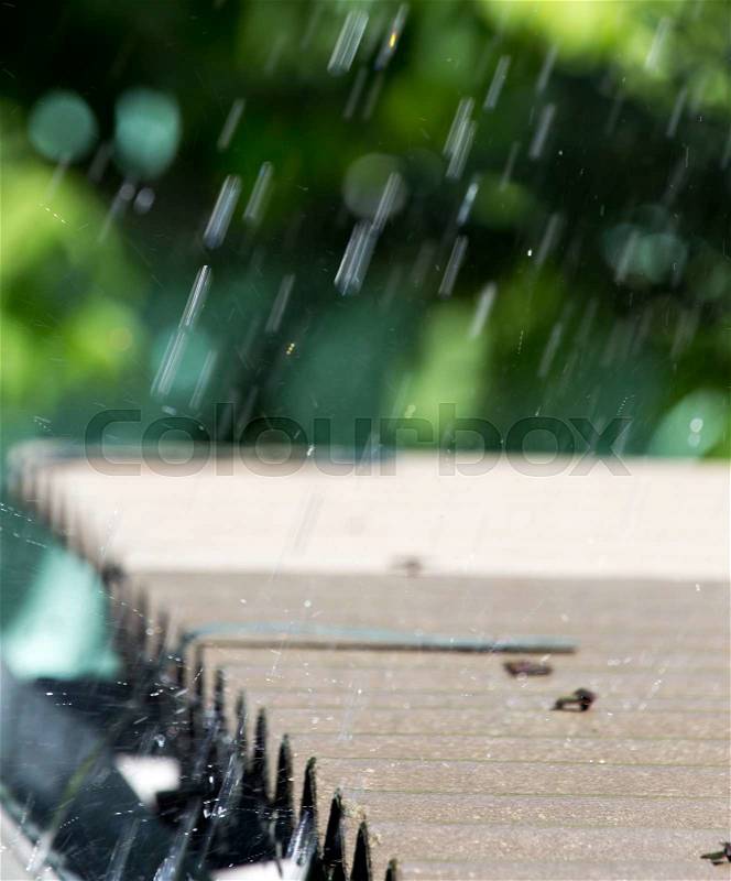 Storm rain on the roof of the house, stock photo