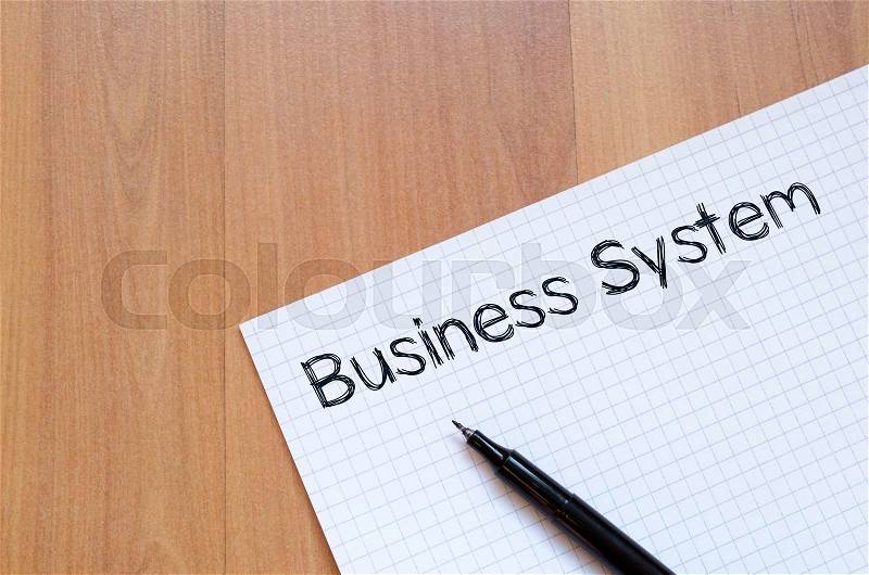 Business system text concept write on notebook with pen, stock photo