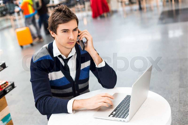 Young successful male freelancer use netbook for distance work during his recreation time, mans hands keyboarding on portable laptop computer, stock photo