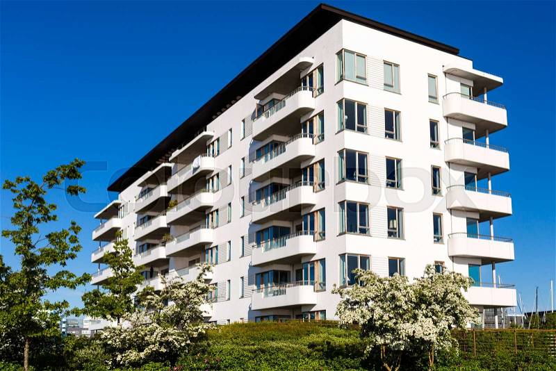 Modern white danish residential condominium building near Copenhagen, Denmark on a sunny day, stock photo