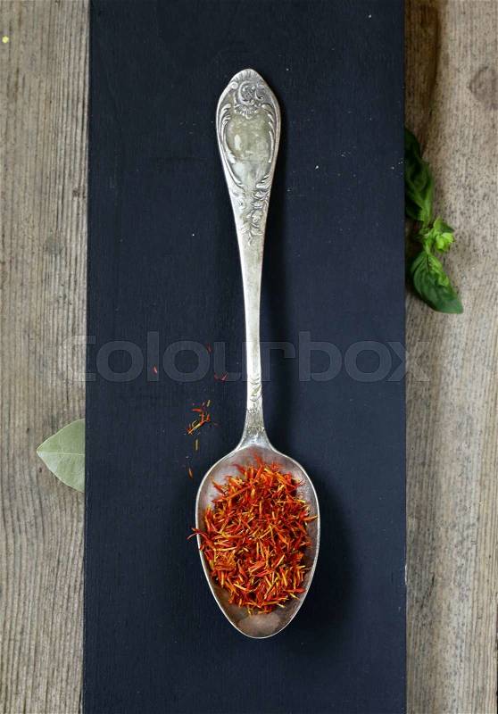 Spice saffron and cumin in a vintage spoons, stock photo