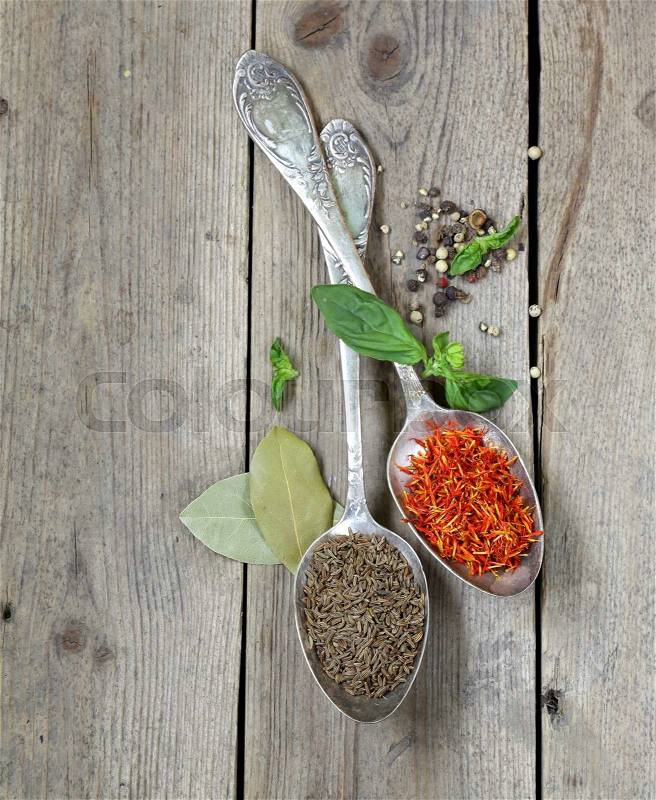 Spice saffron and cumin in a vintage spoons, stock photo