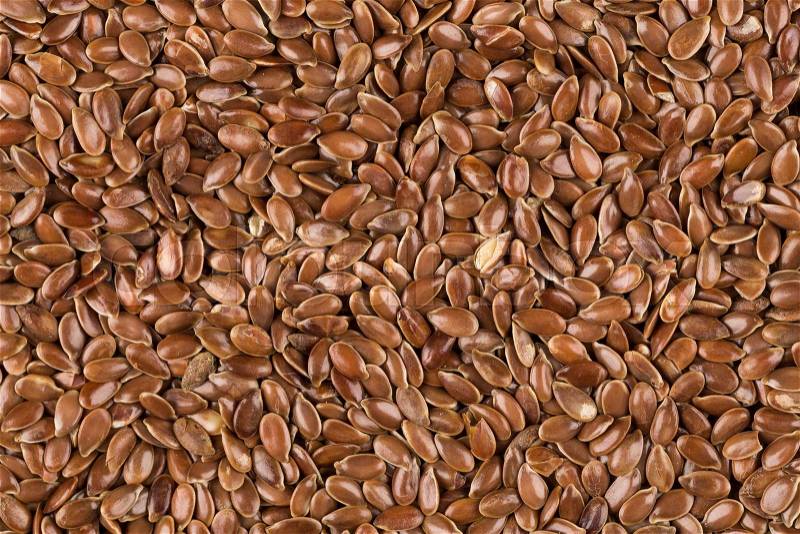 Close up shot of flax seeds background, stock photo