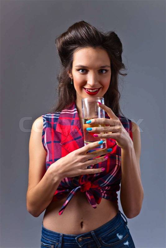 Young beautiful woman with juice , studio shot, stock photo