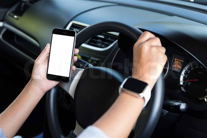 Hand holding phone white screen and driving car, stock photo