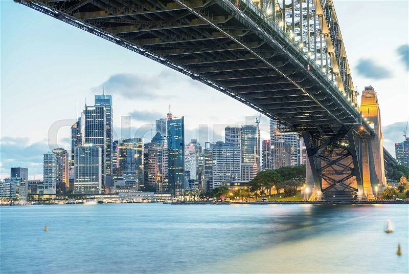 Sydney Harbour Bridge and city night skyline, Australia, stock photo