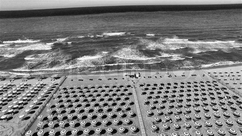 Beach umbrellas and chairs on the beach. Aerial bird eye view, stock photo