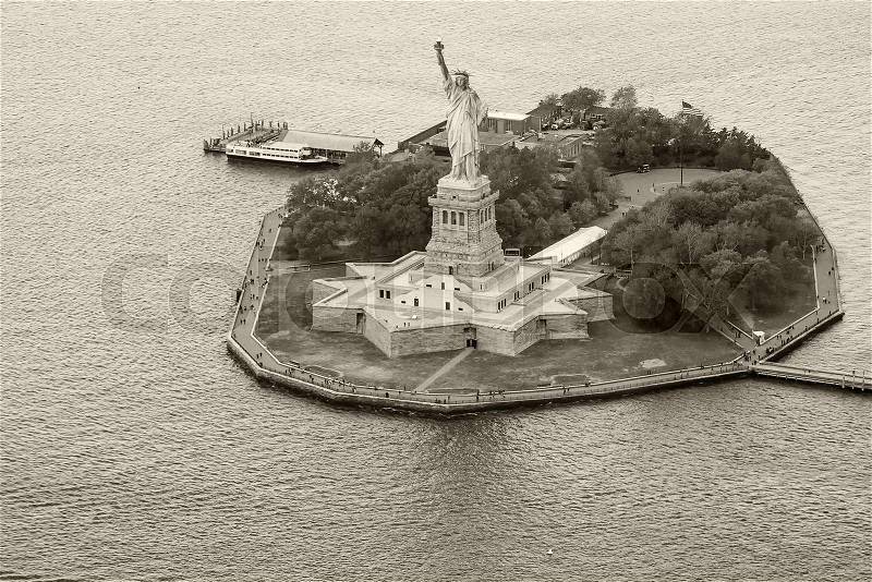 Helicopter view of Statue of Liberty, New York, stock photo