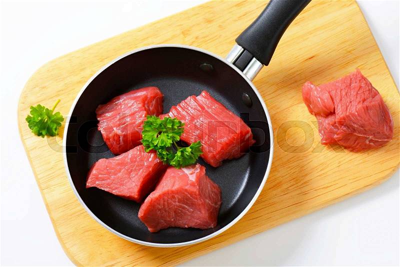 Raw diced beef in a pan, stock photo