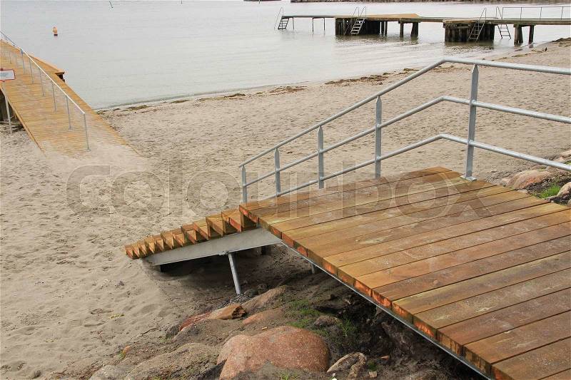 Landing-stage with staircases on the beach of the city Vedbaek in Denmark in the summer, stock photo