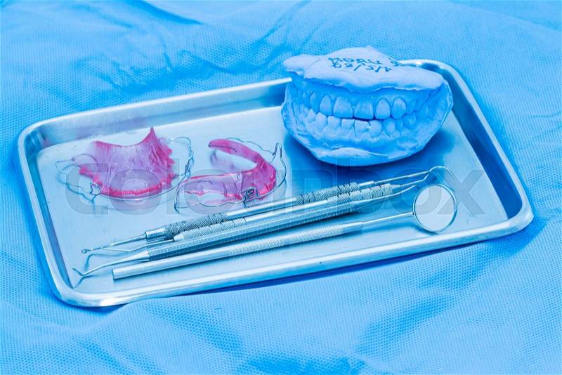 Set of metal Dentist 's medical equipment tools on tray, stock photo