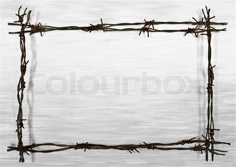 Frame from rusty barbed wire on the unfocused background, stock photo
