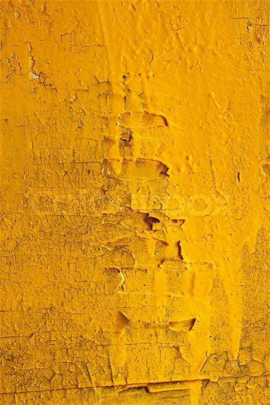 Old wooden surface painted in bright yellow, stock photo