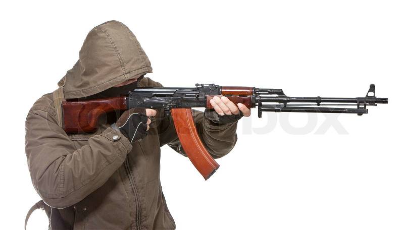 Terrorist with weapon on a white background, stock photo