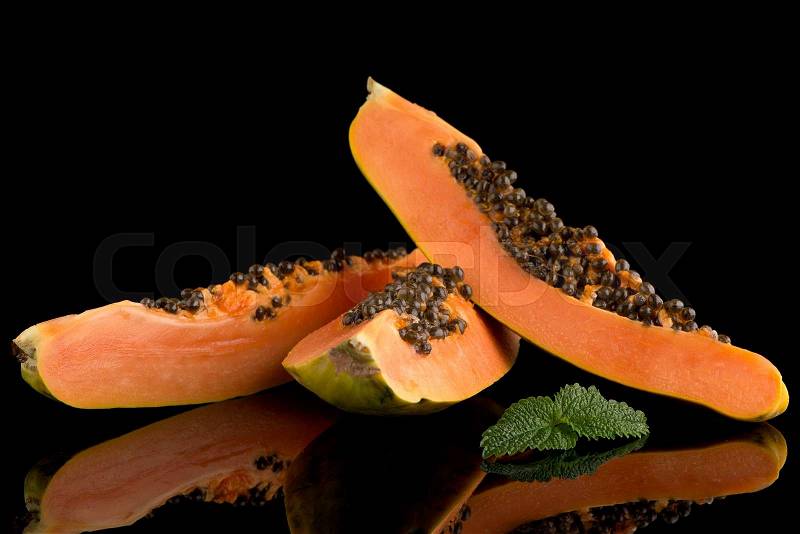 Fresh and tasty papaya on black background, stock photo