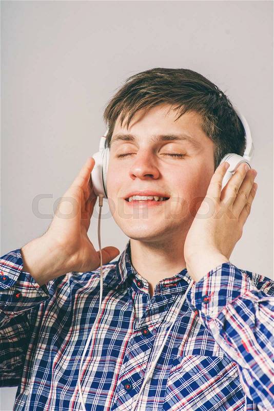Dreaming man listening to music, stock photo