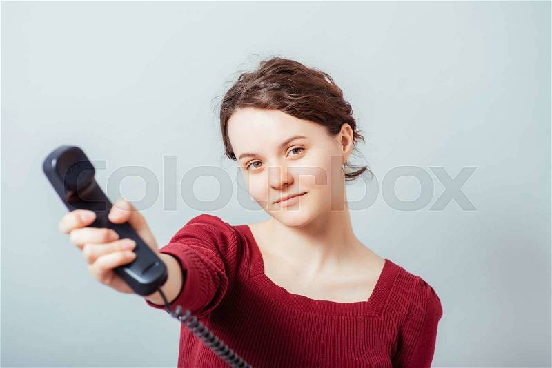Woman gives up the phone, stock photo