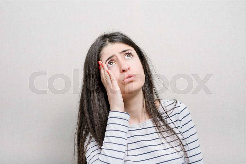 Worried woman have big problem. Girl has headache, stock photo