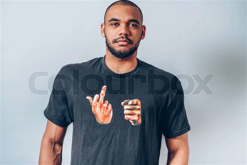 Portrait of a black man in a funny T-shirt, stock photo
