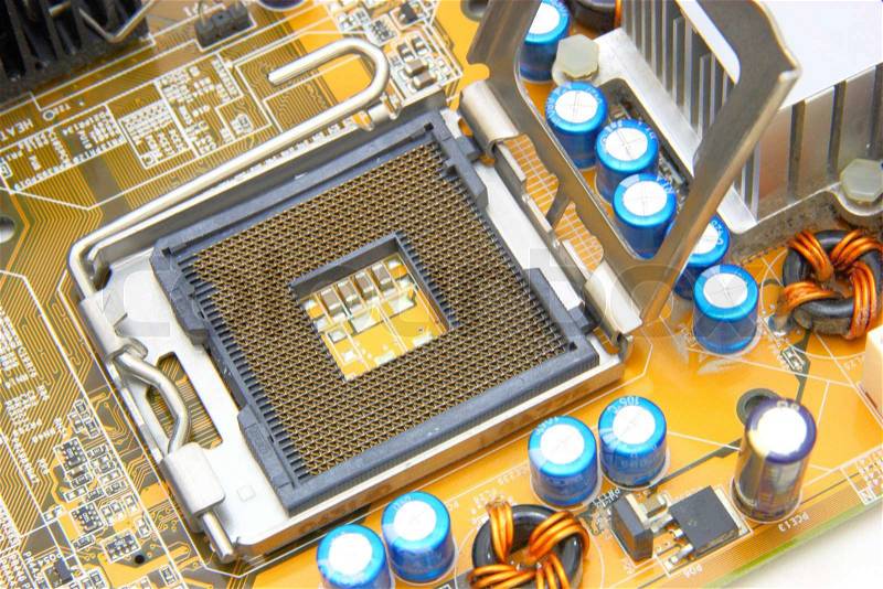 Processor on the yellow computer motherboard, stock photo