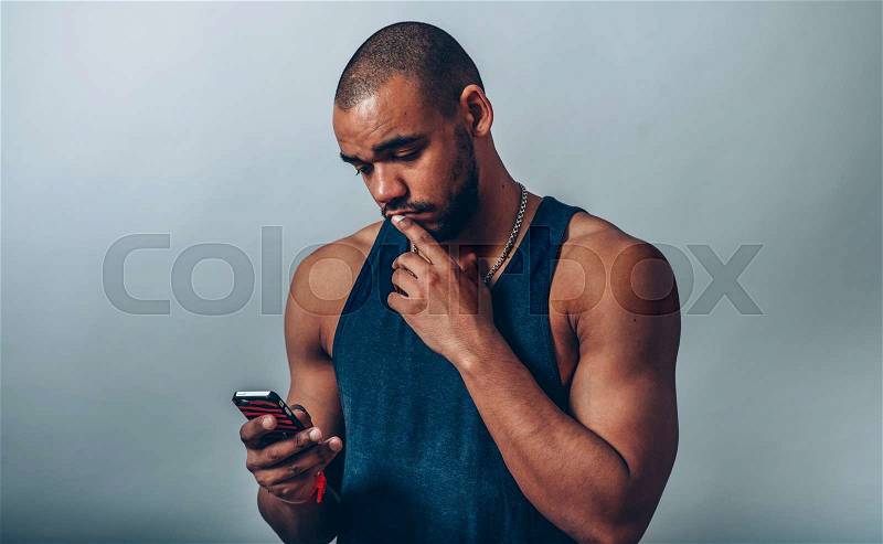 Man looking at cell, stock photo