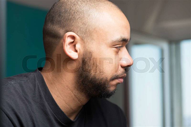 Portrait of a black man in profile, stock photo