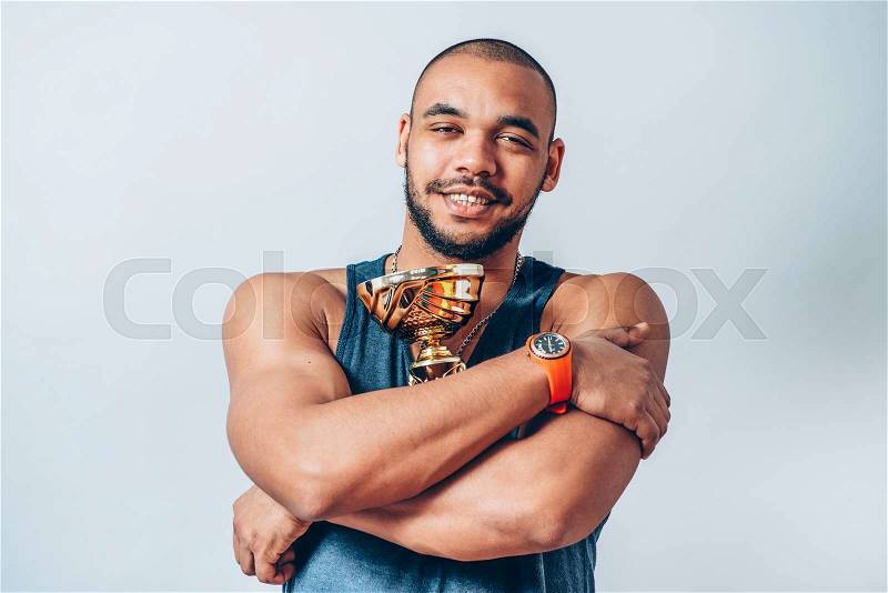 Black man with a Cup Winners, stock photo