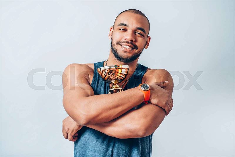 Black man with a Cup Winners, stock photo