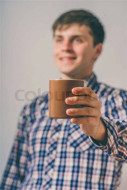 Man with a cup of tea or cocoa, stock photo