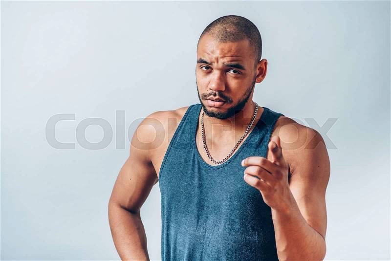 Portrait of an angry man making angry gesture, stock photo